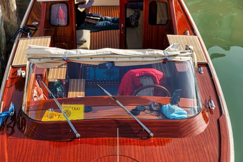 Water taxi, taxi boat, view from above, captain taking a break, Murano, group of islands in the