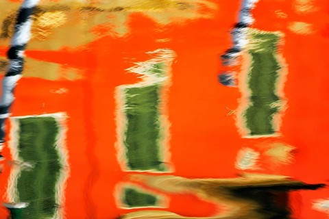 Colourful façade detail reflected in the water of a canal, Burano, Venice, Veneto, Italy