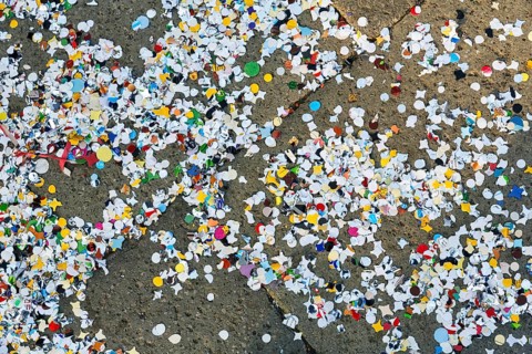 Confetti on asphalt, full-size, symbolic image, waste, environmental pollution, Carnival in Venice,