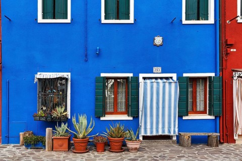 Blue façade detail, various flower pots, Burano, island in the lagoon of Venice, Italy