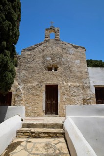 Symmetrical view of a stone church entrance with steeple, Basilica, Church, Agios Theologos, Leros,
