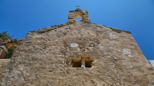 Detail of a stone church façade with architectural elements and steeple, Basilica, Church, Agios
