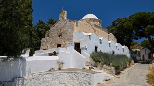 Whitewashed, stone church with dome and trees under a clear blue sky, basilica, church, Agios