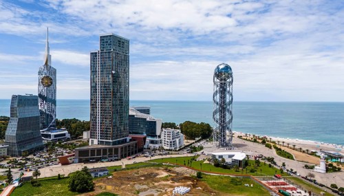 Modern skyline of a city on the coast with impressive skyscrapers and sea view, aerial view, Batumi