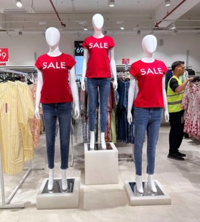 Mannequins display SALE at Zudio clothing store in Guwahati, India, as shoppers browse discounted
