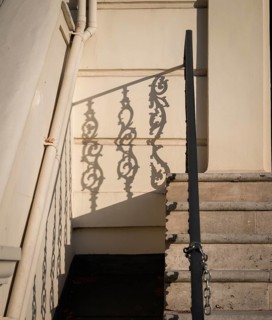 Shadow of an artistically decorated banister on a house wall, Notting Hill, London, England, Great