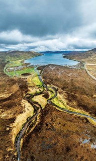 View from Eas a' Bhradain Waterfall from drone, Red Cuillin mountains, Loch Ainort, Isle of Skye,