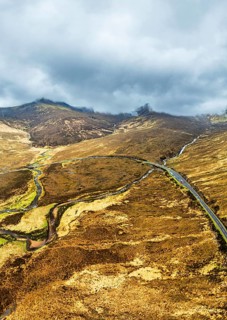 Panorama of Eas a' Bhradain Waterfall from drone, Red Cuillin mountains, Loch Ainort, Isle of Skye,