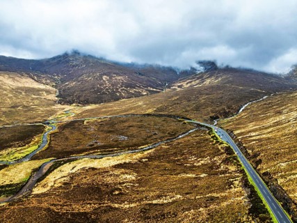 Eas a' Bhradain Waterfall from drone, Red Cuillin mountains, Loch Ainort, Isle of Skye, Scotland,