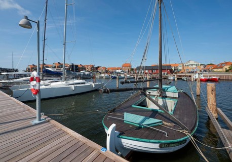 Old sailing boat in the harbour at a jetty, Ringkøbing, Ringkøbing Fjord, Denmark