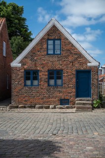 A traditional brick house with a blue door and blue windows, Old Town, Ringkøbing, Ringkøbing