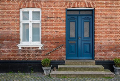 Brick façade with a striking blue door, Old Town, Ringkøbing, Ringkøbing Fjord, Denmark
