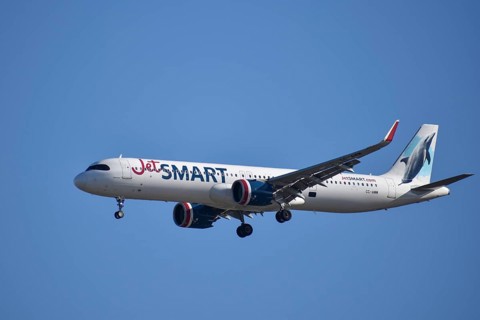 Aircraft Airbus A321 of the low-cost airline Jet Smart with picture of dolphin on the tail, seen in