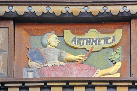 Allegorical woodcarving with figure on Arithmetica, Greek work with algebra, arithmetic,