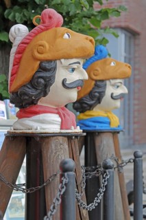 Colourful Swedish heads as landmarks, historical wooden head with face and four eyes, Swedish head