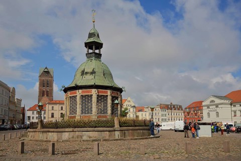 Renaissance water art with dome and St Mary's Church tower, landmark, market square, Wismar,