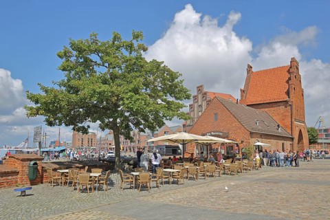 Historic water gate as part of the former town fortifications, street pub, restaurant, pedestrian,