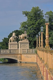 Castle bridge with two horse figures, castle lake, street lamps, shore, balustrade, Schwerin,