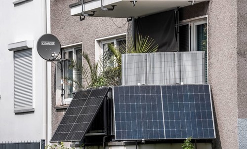 Residential building with photovoltaic modules on the balcony, balcony power plant, North