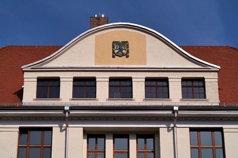 Blaumännle, heraldic figure, town coat of arms, logo, front of the primary school, Blaubeuren,