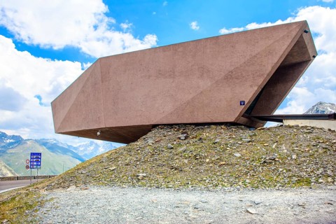 Timmelsjoch Pass Museum of reddish-coloured concrete with entrance on Austrian territory on the