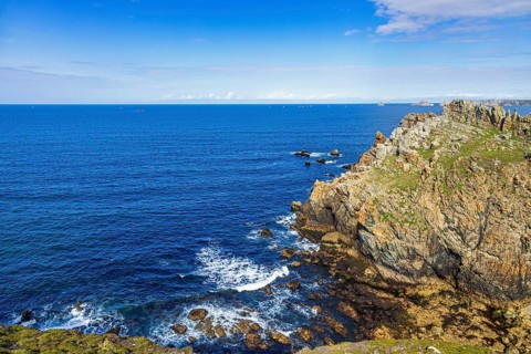 Rocky coast with a scenics sea view towards the horizon a sunny summer day by the sea, Crozon