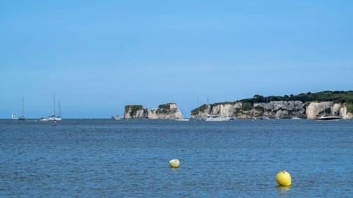 Boats on sea over Knoll Beach Studland, Poole, Dorset, England, United Kingdom
