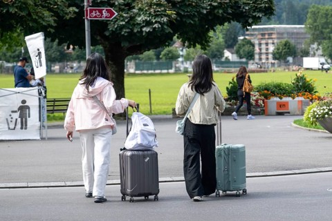 Tourists with luggage, Interlaken, Bern, Switzerland