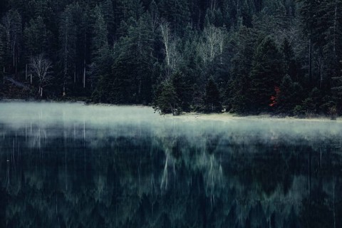 Sunrise with reflections in the Plansee in Tyrol in the Alps in Austria