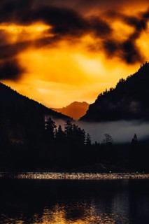Surreal light atmosphere at sunrise at Plansee, Tyrol, in the Alps in Austria