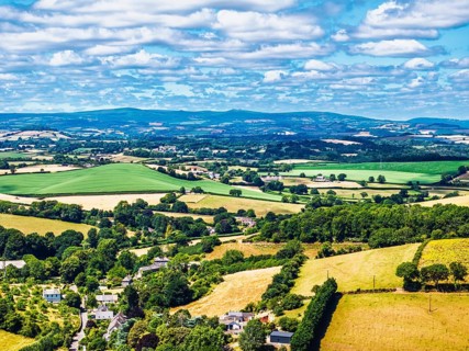 DefaultFarms and Fields over Torquay from a drone, Devon, England, United Kingdom