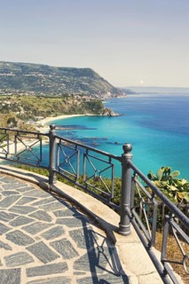 Viewing platform with railings offers a sweeping view of the coast and the sea, Ricadi, Capo