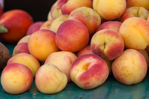 Fresh peaches on a market stall, market sale, Provence, France