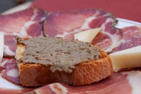 Crostini with liver cream, ham, sausage and cheese platter, Montalcino, Tuscany, Italy