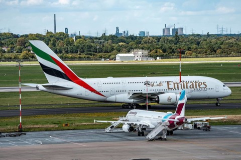 Düsseldorf Airport, Eurowings Airbus aircraft on the apron, Emirates Airbus A380-800 on its way to