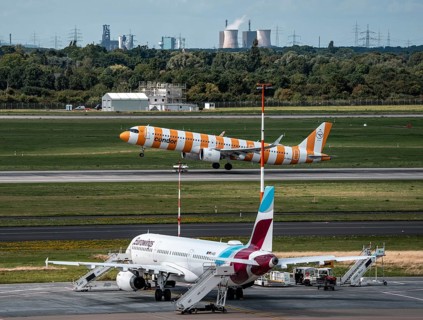 Düsseldorf Airport, Eurowings Airbus aircraft on the apron, Condor Airbus A321-200 taking off, in