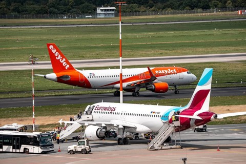 Düsseldorf Airport, Eurowings Airbus aircraft on the apron, EasyJet Airbus A320-200 taxiing for