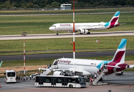 Düsseldorf Airport, Eurowings aircraft taking off, Eurowings Airbus on the apron, passengers