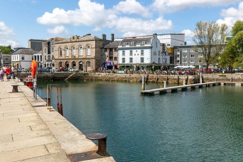 People sitting outside The Three Crowns pub quayside harbour, The Barbican, Plymouth, Devon,