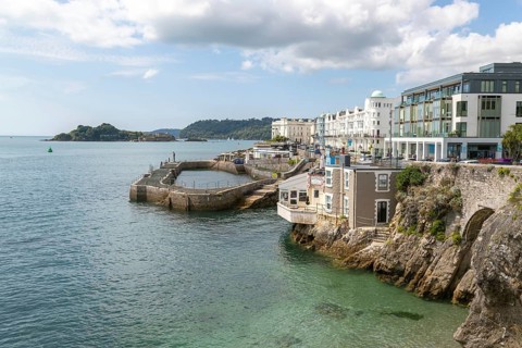 Seafront coastline waterfront, city of Plymouth, Devon, England, UK view west to Drake's Island and