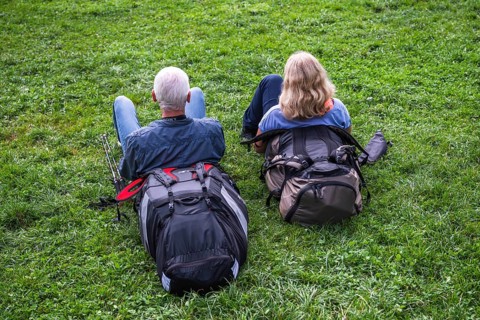 Couple resting in the grass, Interlaken, Bern, Switzerland