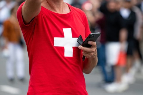 Symbol photo Mr Swiss with mobile phone, Interlaken, Bern, Switzerland