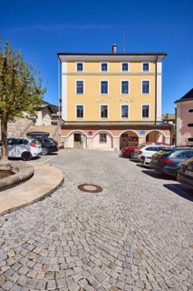 Town hall, general architecture, car park, vehicles, square, cobblestones, tree, blue sky,