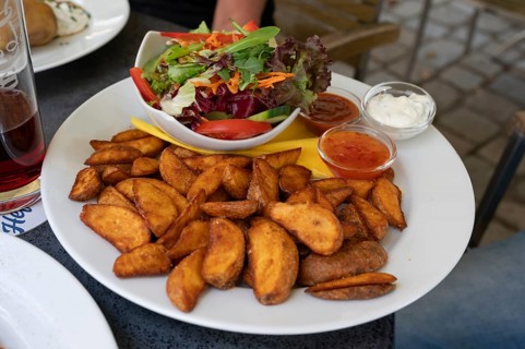 Potato wedges, with salad and dips, Bavaria, Germany