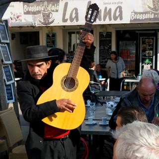 Traditional guitar player, singer in a restaurant, pilgrimage in Saintes-Maries-de-la-Mer,