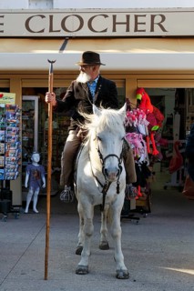 Guardian of the Camargue, traditional herdsman, rider on Camargue horse, pilgrimage, procession in