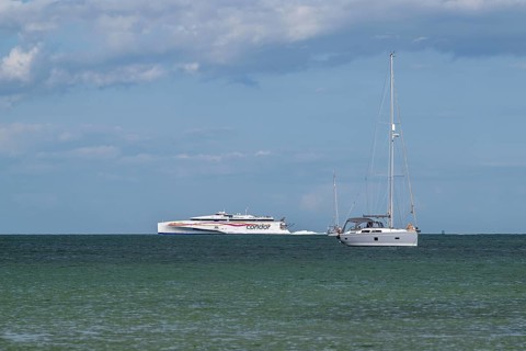Boats on sea over Knoll Beach Studland, Poole, Dorset, England, United Kingdom