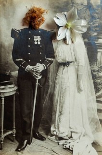 A couple dressed in historical wedding attire stands together. Their faces are creatively replaced