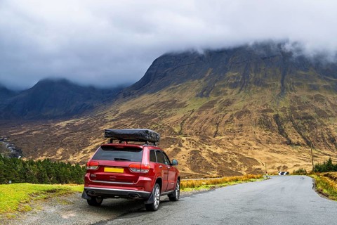 Off road 4x4 car with roof tent on Fairy Pools and Waterfalls, Glen Brittle, Black Cuillin, Isle of