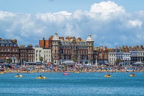 Clock tower on seaside in Weymouth, Esplanade, Weymouth, Dorset, England, United Kingdom